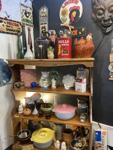 This Week in My Booths: Vintage Finds and a Few New Additions - wood shelf with a mixture of vintage tin, 1950s casseroles & more!